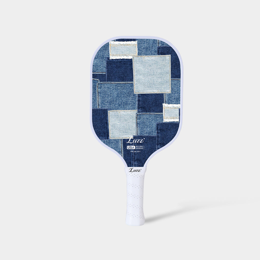 LUZZ Denim Mosaic Original Paddle featuring a denim patchwork-style paddle face with the LUZZ logo at the bottom and a white handle