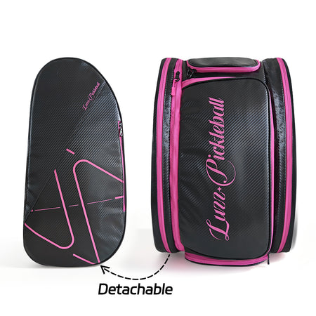 Black pickleball backpack with a detachable side pouch, pink zippers, a pink LUZZ logo, and minimalist line detailing
