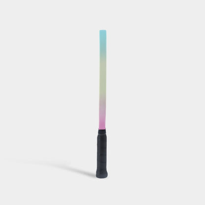 Paddle standing upright, side view, with a pastel blue-to-yellow-to-pink gradient edge.