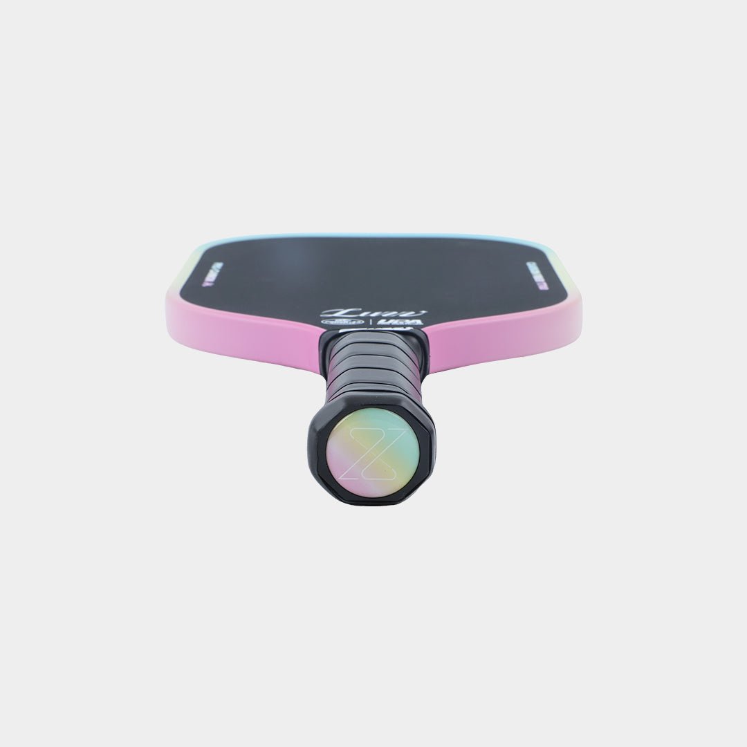Paddle lying flat, perspective view with the handle base facing forward, featuring a candy-colored base with a cutout Z.