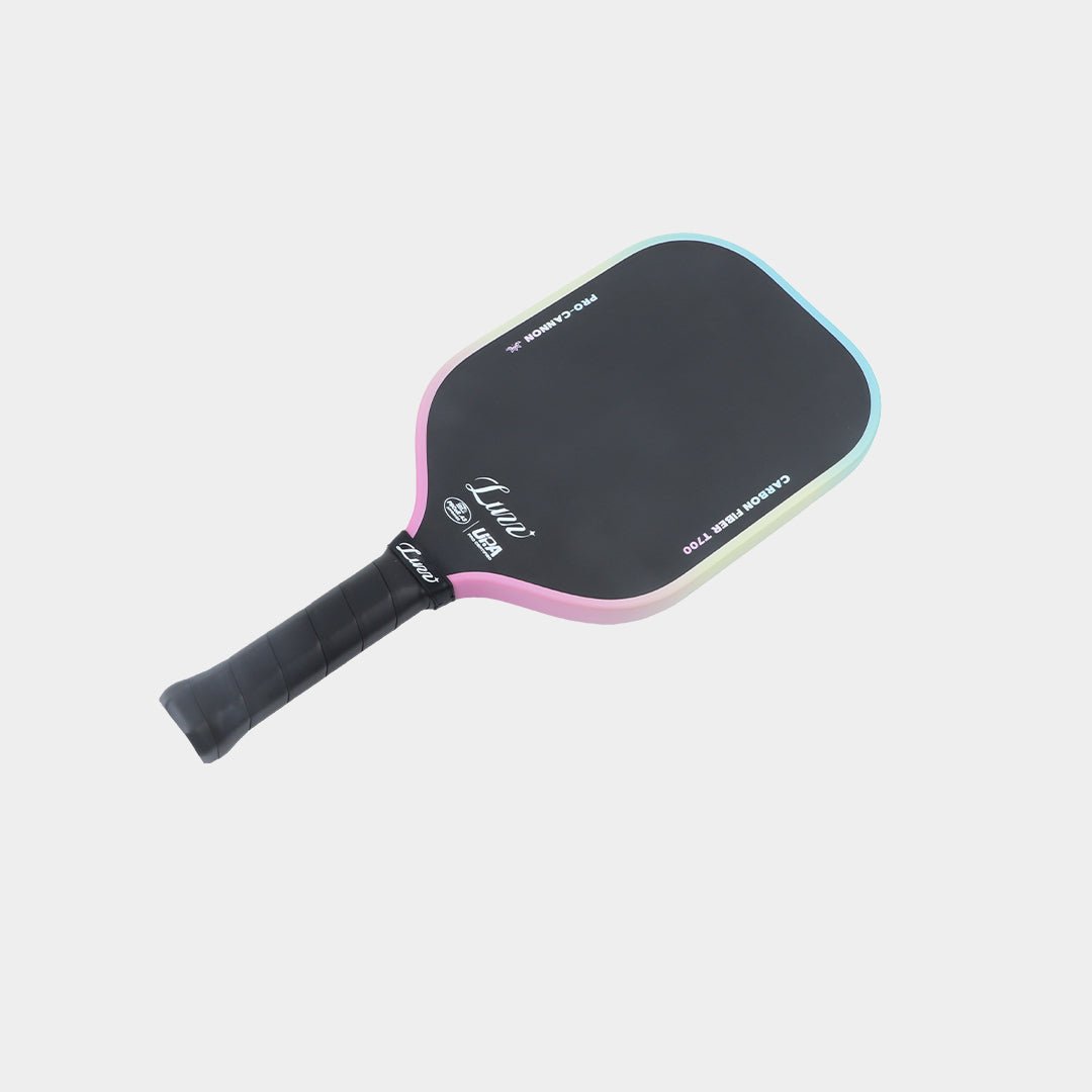 Paddle lying flat, face up, with a black face featuring the Luzz logo and a black handle.