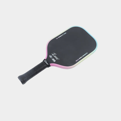 Paddle lying flat, face up, with a black face featuring the Luzz logo and a black handle.