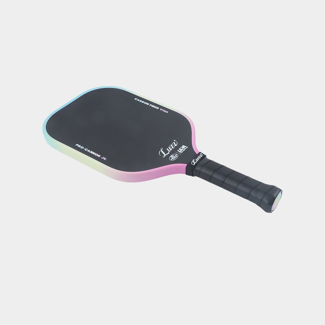 Paddle lying flat, face up, with a black face featuring the Luzz logo and a black handle.