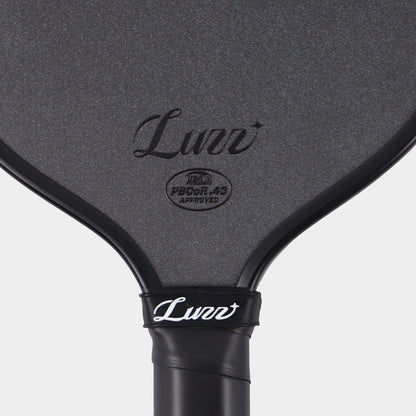 Close-up of the LUZZ Cannon XPP M1 textured face, logo and approval mark