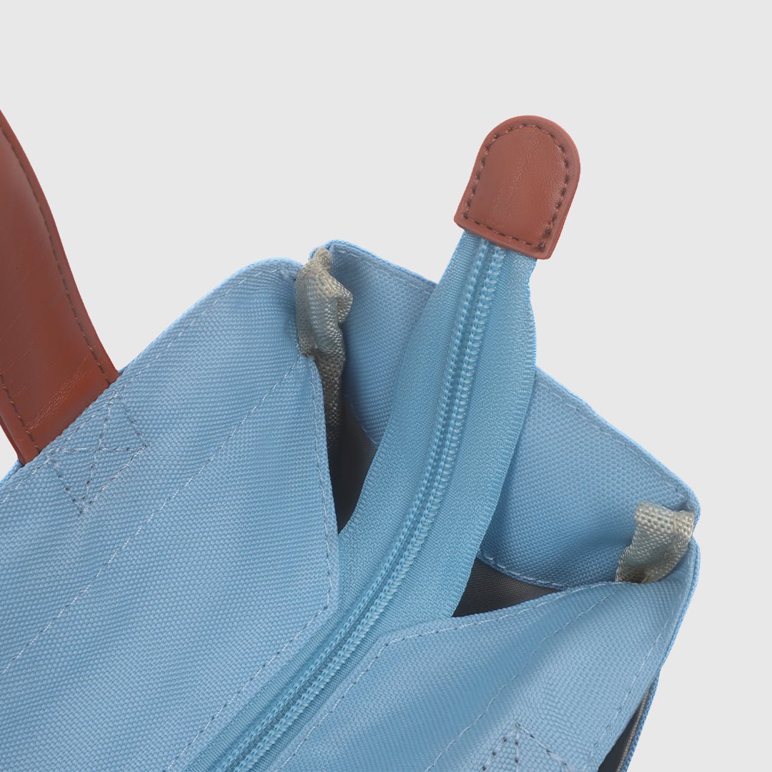 Close-up detail of the zipper pull on the Jean Blue pickleball bag.