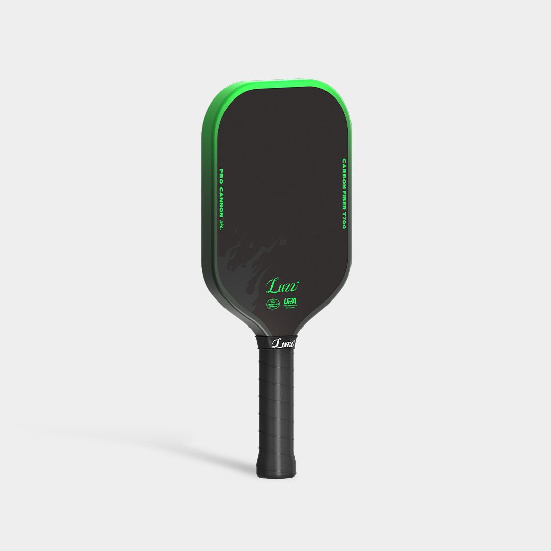 LUZZ Green Flame Cannon pickleball paddle upright left-side view featuring a green-to-black gradient side edge with black “TOXIC INCENDIARY” lettering and a black handle