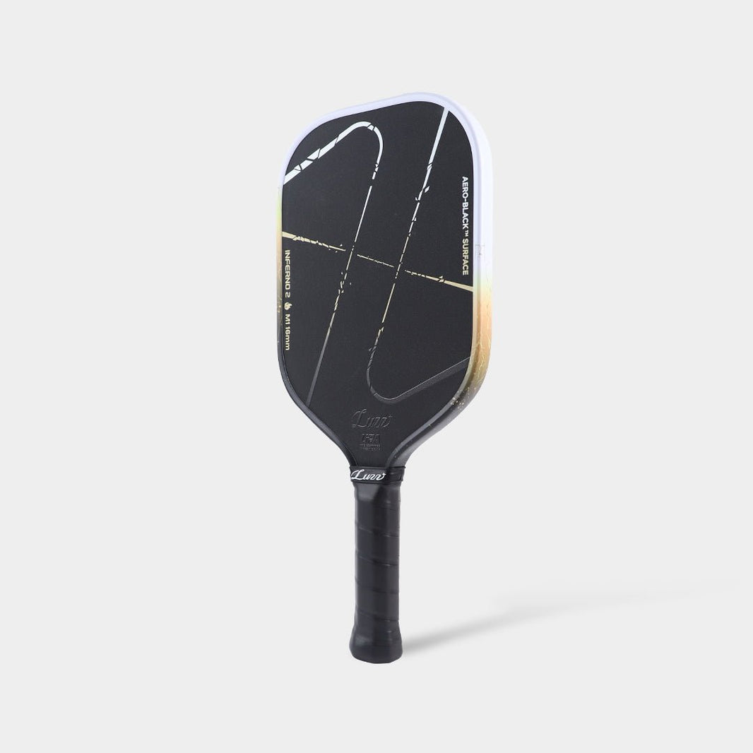 Luzz Inferno2 M1 Dawn standing upright at an angled side view, with a white-to-gold-to-black gradient edge and black handle.