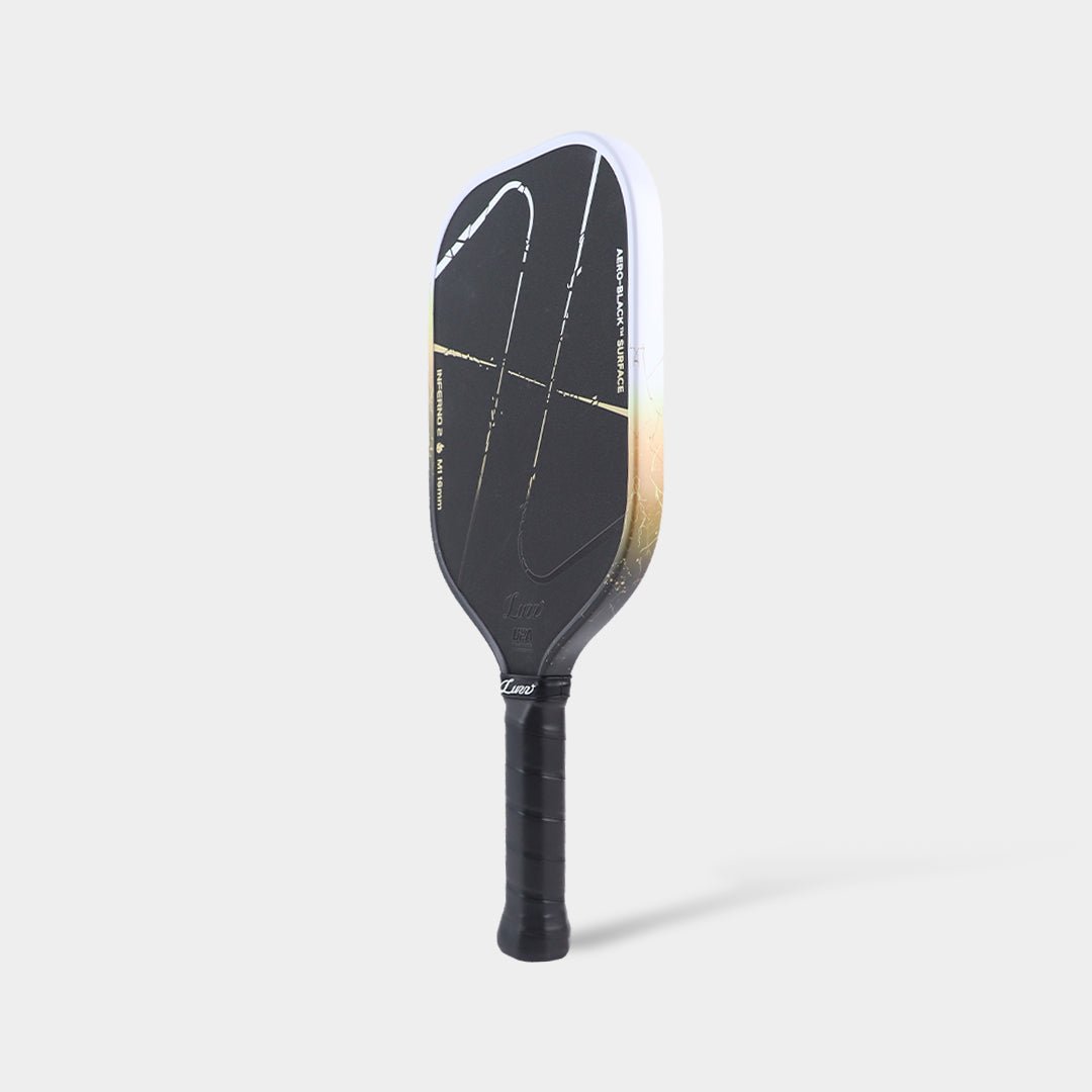 Luzz Inferno2 M1 Dawn standing upright at an angled side view, with a black face, gradient edge, and black handle