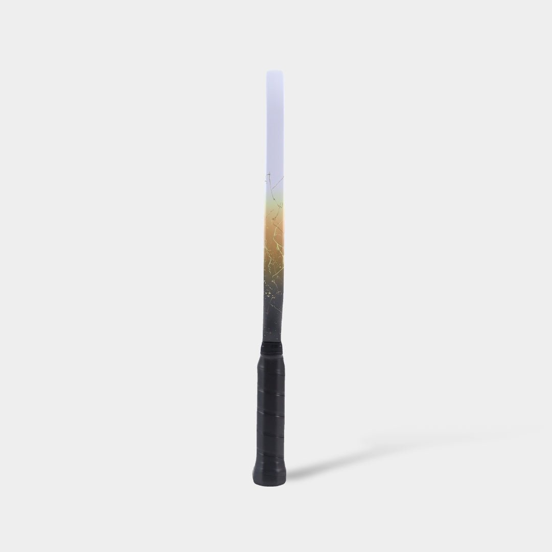 Luzz Inferno2 M1 Dawn standing upright, side view, with a white-to-gold-to-black gradient edge featuring a patterned design and a black handle.
