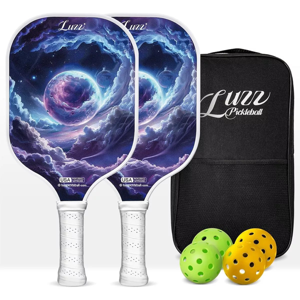Two paddles arranged front and back, featuring a dreamy planet artwork design on the paddle face, a navy blue back, and white handles. A black paddle bag, two indoor balls, and two outdoor balls are placed on the right side of the paddles.