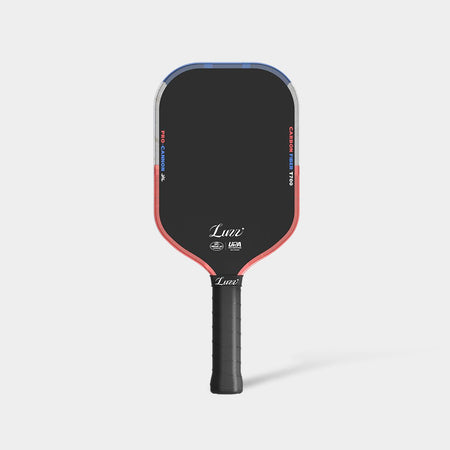 LUZZ Iron Cannon pickleball paddle featuring a solid black paddle face with blue, gray, and orange color-blocked edges, orange-and-blue “PRO-CANNON” and “CARBON FIBER T700” lettering on each side, white LUZZ logo and UPA-A and USAP certification logos at the bottom, and a black handle