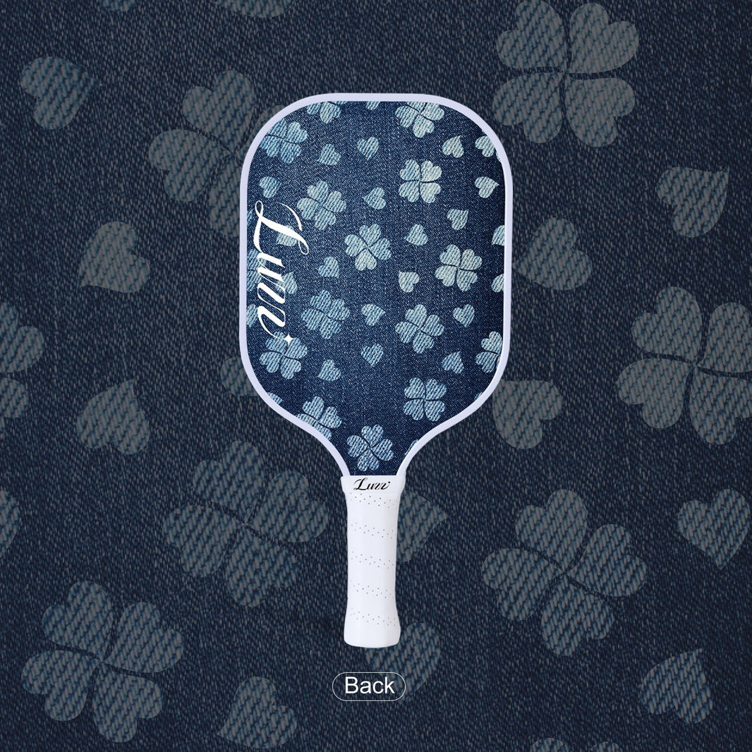 LUZZ Lucky Denim Original Paddle back view featuring a denim-blue paddle face with a four-leaf clover graphic and a script LUZZ logo on the left side
