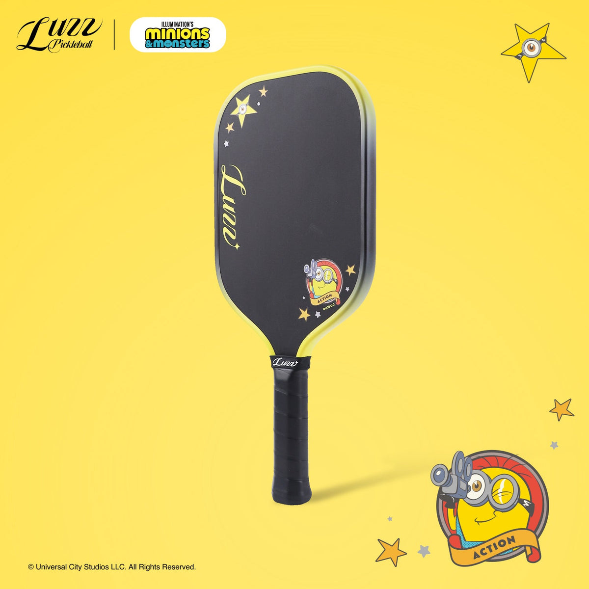 45-degree side view of a pickleball paddle featuring a black paddle face with a Minions graphic and LUZZ logo, with a black-to-yellow gradient edge