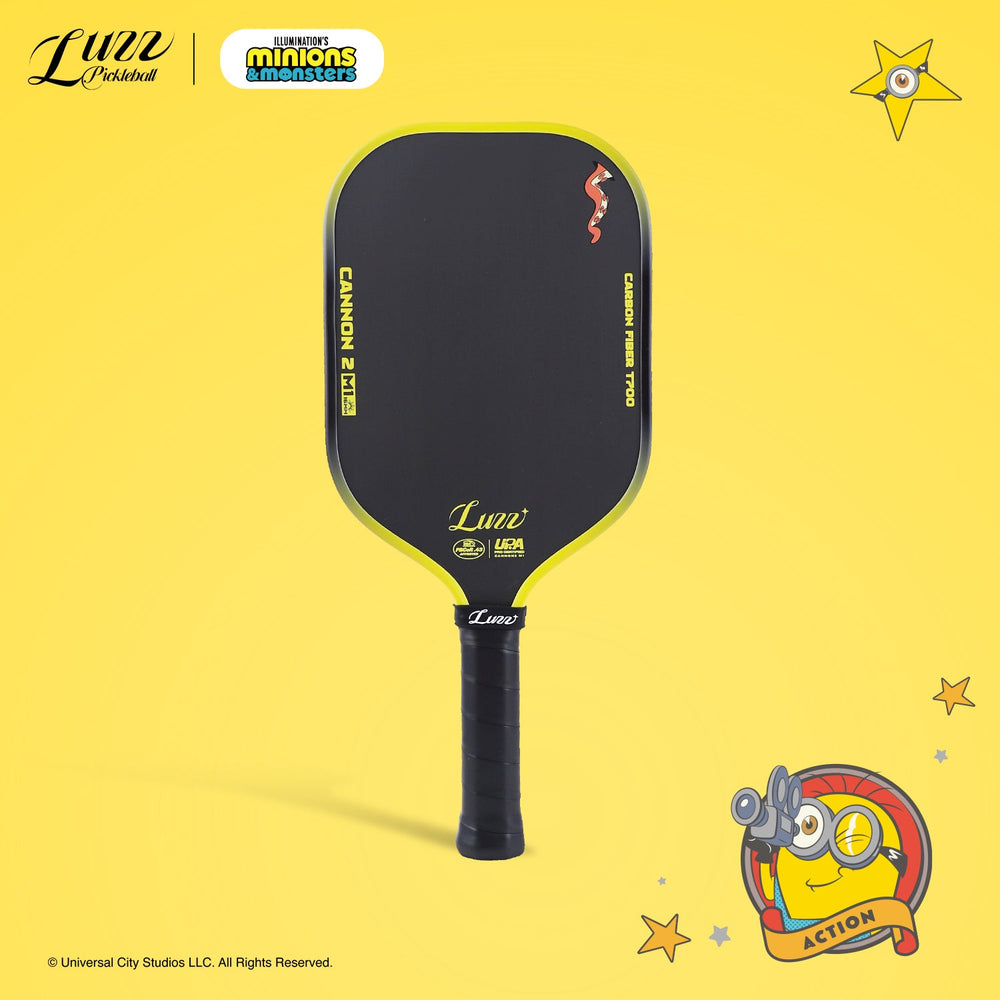 Front view of a pickleball paddle on a yellow background, featuring a yellow LUZZ logo and UPA-A and USAP certification logos