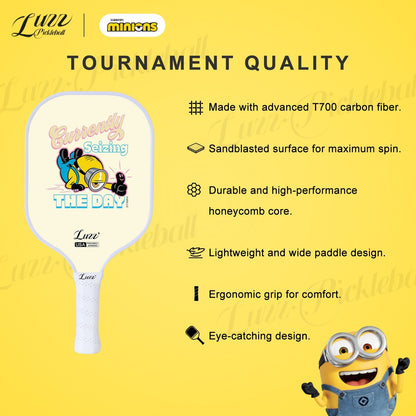 Minions collaboration Carpe Diem pickleball paddle featuring premium construction and durable performance design with T700 carbon fiber, sand-textured surface, honeycomb core, lightweight wide-body shape, and ergonomic grip