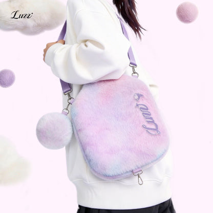 Pink-and-purple plush pickleball paddle cover worn crossbody with the front facing forward, a plush mini ball pouch attached on the left side, and the shoulder strap adjusted to a single-shoulder length