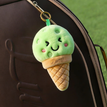 LUZZ Smiling Ice Cream Plush Charm hanging from a pickleball bag