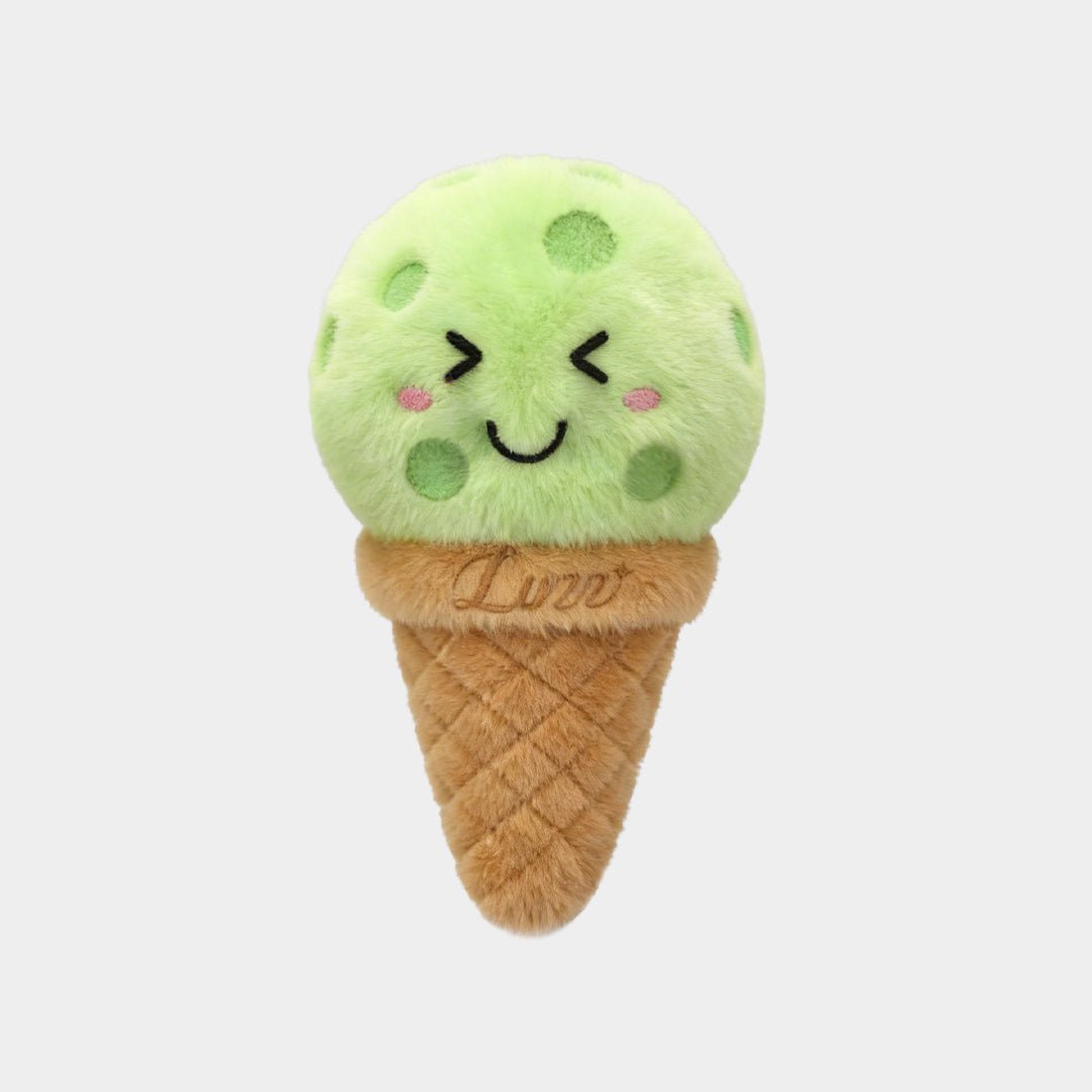 LUZZ Smiling Ice Cream Plush Charm featuring a green ice cream scoop, brown cone-shaped base, stitched LUZZ logo, and brown hanging cord