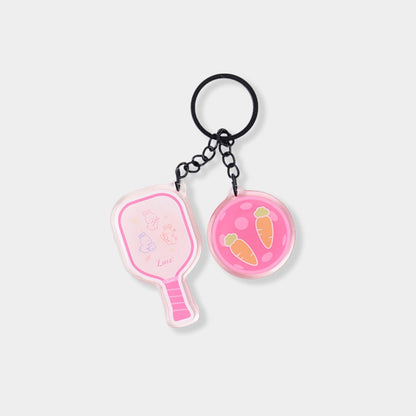 Acrylic pickleball paddle-shaped keychain with Bunny design and glossy epoxy finish.