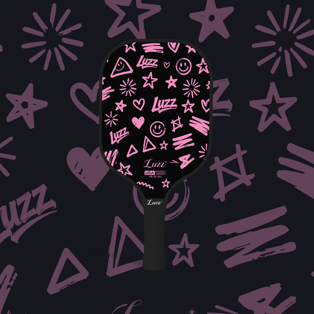 LUZZ Pink Doodle Original Paddle featuring a black paddle face with playful pink doodle graphics and a black handle