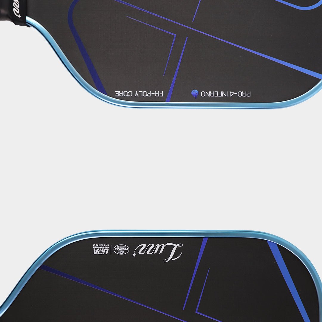 Close-up detail of two paddles placed parallel, featuring white FR-POLY CORE and PRO-4 INFERNO text on the left side, with white LUZZ logo and UPA-A & USAP certification logos on the right side.