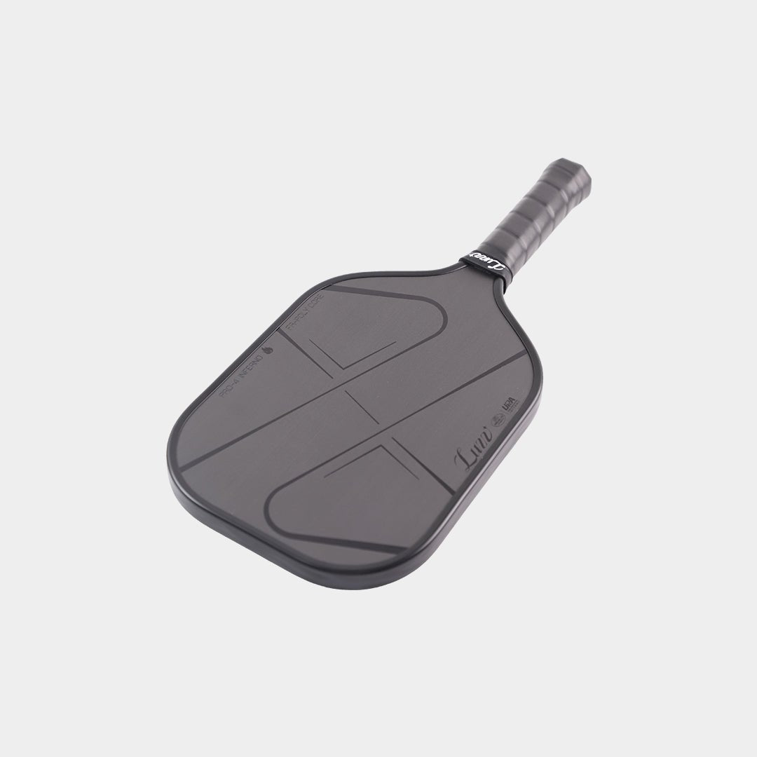 LUZZ Pro 4 Darkness Inferno pickleball paddle angled with the paddle head facing forward, featuring glossy black LUZZ logo and UPA-A and USAP certification logos along the left edge of the paddle face, and glossy black “PRO-4 INFERNO” and “FR-POLY CORE” lettering along the right edge