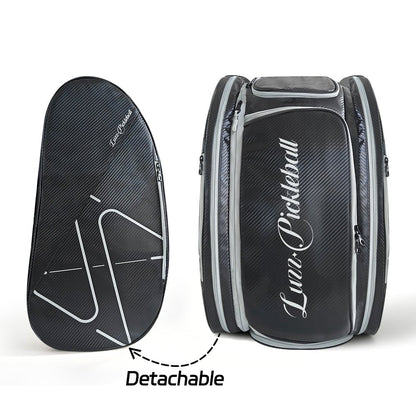 Black pickleball backpack with a detachable side pouch, featuring a white LUZZ logo and minimalist line details