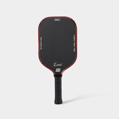 LUZZ Rare Cannon pickleball paddle front view featuring a solid black paddle face with gold lettering, a red edge, and gold side accents