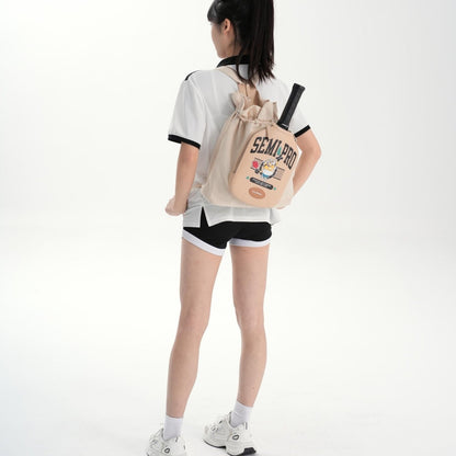 Beige LUZZ Minions Collaboration Pickleball Backpack worn as a backpack, with the shoulder strap zipper unzipped to showcase the dual-strap carrying style